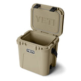 Tan YETI cooler with open lid on a white background