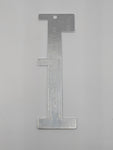 Close-up of combination fish gauge showing engraved measurements for Crab, Cray and Abalone