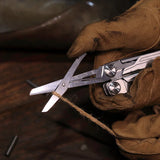 NexTool Flagship Captain multitool with pliers, knife blade, saw, scissors, and multiple fold-out tools in a compact stainless steel design