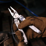 NexTool Flagship Captain multitool with pliers, knife blade, saw, scissors, and multiple fold-out tools in a compact stainless steel design