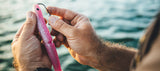 Daiwa Bait Junkie 10" Gar soft plastic lure, a long slender baitfish imitation designed for casting at predatory fish.