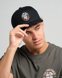 Black twill snapback cap with embroidered Ship For Brains graphic, structured crown, flat brim, and adjustable snapback closure for a classic fit