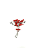 Small red Saltatrix Easy Rig running sinker clips with stainless steel snap clips on a white background.