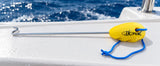 Iki Pik floating fish hook remover with stainless steel shaft, bright yellow buoyant handle and blue lanyard, designed for safe and easy fishing hook removal on boats.