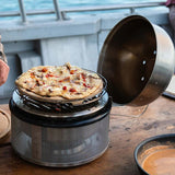 Fresh pizza cooking on COBB Pizza Stone outdoors