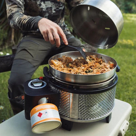 COBB Wok cooking stir-fry on outdoor BBQ