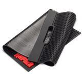 Rapala Fillet Mat laid flat with textured non-slip surface and raised ribs, designed to securely hold fish in place during filleting and cleaning on a boat or outdoor workstation.