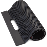 Rapala Fillet Mat laid flat with textured non-slip surface and raised ribs, designed to securely hold fish in place during filleting and cleaning on a boat or outdoor workstation.