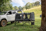 Raised camping swag platform with detachable boot bag and gear organiser.